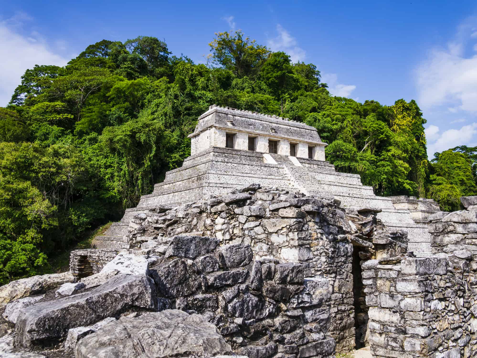 <p>Located in the state of Chiapas, the Pyramids of the Inscriptions are several pyramids in the ancient site of Palenque. These pyramid structures aren't that tall, only 89 feet, but there were temples built on top of these pyramids, which is what makes them extremely unique. The pyramids' temples have Mayan hieroglyphics written all over them. This is why they were named the Pyramids of the Inscriptions. Palenque is an archeological zone that is still being excavated and archeologists believe that only 10% has been uncovered so far.</p>