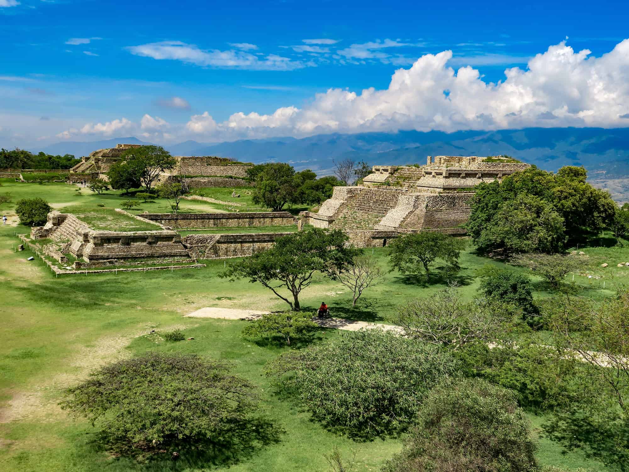 <p>The Zapotec people built the pyramids located in Monte Albán. About 2,500 years ago, they inhabited the area of what is now Oaxaca. Fascinatingly enough, one of the few tribes that had developed a writing system in the western part of the world. Monte Albán was the capital of the Zapotecs. It is believed they were trading partners with those tribes that lived in Teotihuacan. When you visit, you can explore all the ruins in the ancient city, which houses tombs, temples, and even stone carvings.</p>
