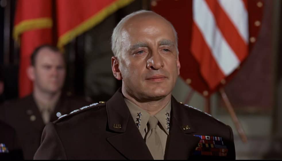 <ul> <li><strong>Delivered by:</strong> George C. Scott playing George Patton</li> <li><strong>Speech:</strong> Rallying the troops before the invasion of France</li> </ul> <p>One of the most enduring scenes in film history comes from the opening of the 1970 film "Patton," where George C. Scott, portraying U.S. General George S. Patton, addresses troops against the backdrop of a giant American flag during World War II. In his speech, he emphasizes the significance of examplary leadership and the necessity of a team effort needed to defeat the enemy. This is a shorter (and less explicit) version of Patton's actual address to the Third Army in 1944, prior to the Allied invasion of France.</p>