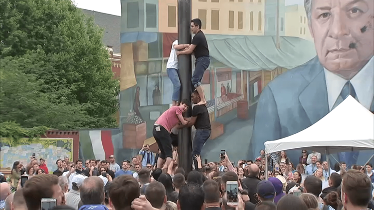 People climb Italian Market’s greased pole