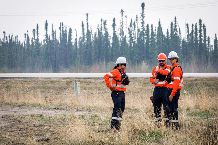 Wildfire specialists with Fire & Flood Emergency Service Ltd., pictured along Highway 881 near Gregoire Lake Estates southeast of Fort McMurray on Wednesday, May 15, 2024.
