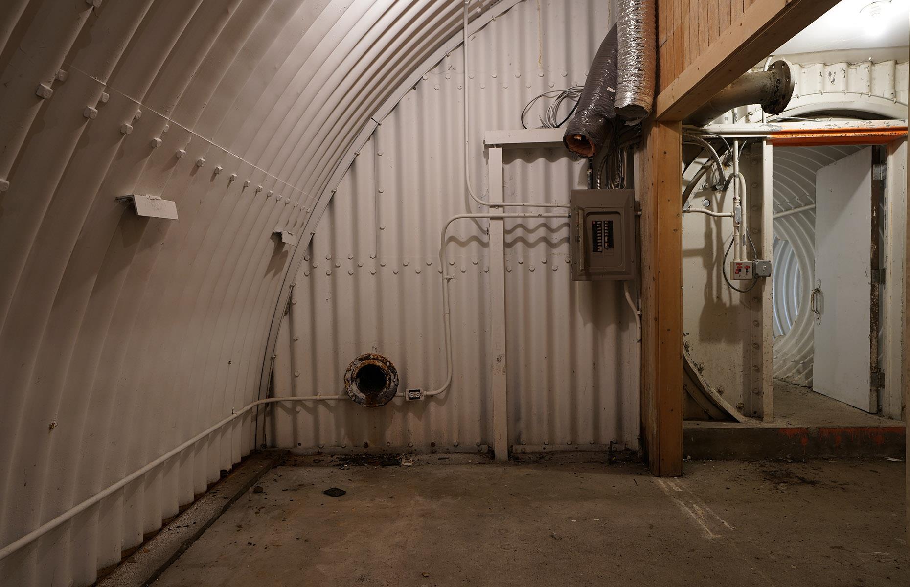 <p>The bunker was erected quickly. Ideally, it would have been built deep underground, but as Nantucket is a relatively small island, digging down meant hitting water. Instead, the shelter was made up of Quonset huts; prefabricated structures that were developed during the Second World War. Earth was then piled on top of the huts and scrub was left to grow over the shelter, camouflaging the site from any prying Soviet spies. </p>  <p>While that doesn't sound like much, “a shelter only needs three feet of dirt on top, and you can stay there safely until the radiation levels have come down,” bunker-building expert <a href="https://www.bradleygarrett.com/bunker/">Bradley Garrett</a> told the <a href="https://www.smithsonianmag.com/history/inside-jfks-secret-doomsday-bunker-180981574/"><em>Smithsonian Magazine</em></a>.</p>  <p><strong>Liking this? Click on the Follow button above for more great stories from loveEXPLORING</strong></p>