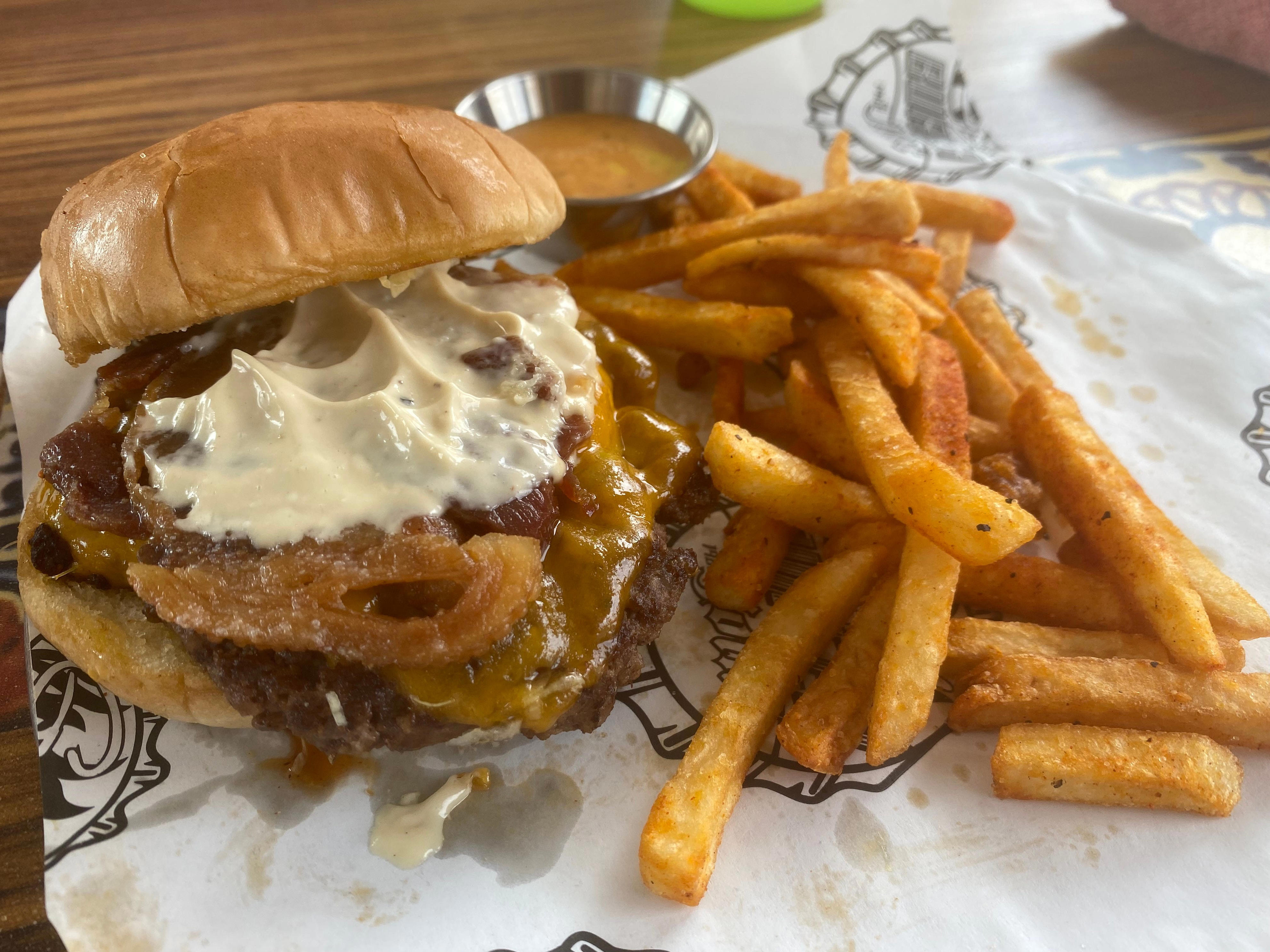 <p>Nothing goes better with burgers than hot fries, so I got some every time I ate at Guy's Burger Joint. </p><p>Even though the menu said the fries were hand-cut, they tasted more like <a href="https://www.businessinsider.com/chefs-share-how-to-make-frozen-french-fries-taste-better">frozen fries</a> — but that's completely fine by me. They stayed crisp for a long time. </p><p>They were tossed in a spice blend that tasted like a mix of salt, paprika, and possibly garlic powder. I tried to get the chef to share the recipe but had no luck.</p><p>Beyond tasting delicious on their own, the fries were a perfect vehicle to get more of my favorite chipotle-mayo sauce into my mouth.</p>