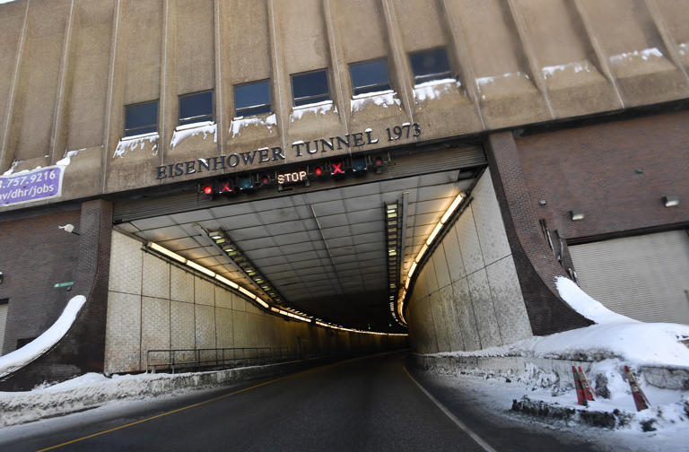 CLEAR CREEK COUNTY , COLORADO - FEBRUARY 22: The westbound entrance to the Eisenhower Tunnel on February 22, 2021 in Clear Creek County, Colorado. The tunnels are nearing 50 years old, and they're in need of major upgrades and upkeep to keep this most vital link in Colorado's interstate system running. If the tunnels were to face emergency closure, it would wreak more havoc than pretty much any other link in the system. The Eisenhower Memorial Tunnel, about 60 miles west of Denver on Interstate 70, sits at an elevation of 11,013 feet at the East Portal and 11,158 feet at the West Portal. The Tunnel traverses through the Continental Divide at an average elevation of 11,112 feet. When originally opened in the 1970s, the tunnel was not only the highest vehicular tunnel in the U.S, but at that time it was also the highest in the world. The tunnel sees 35,000 vehicles driving through a day. The tunnels are staffed 24 hours a day every day of the year.