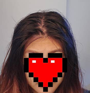 a reviewer's greasy hair before using the dry shampoo