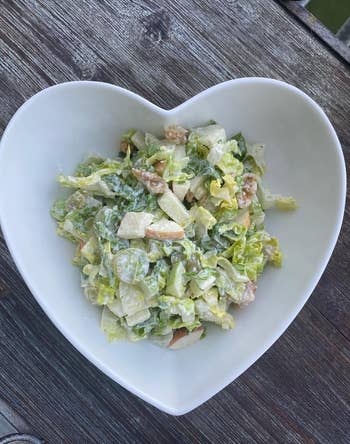 Caesar salad served in a heart-shaped bowl