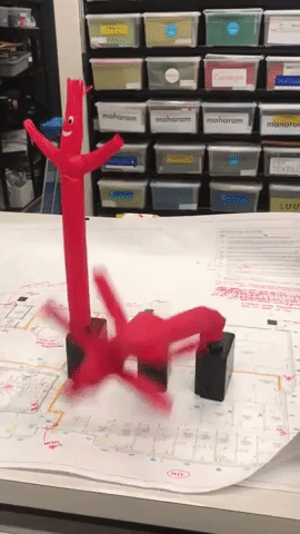 Gif of three mini wacky waving inflatable tube guys flailing