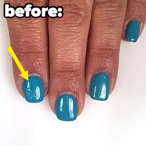 before photo of teal nail polish that's smudged on the pointer finger