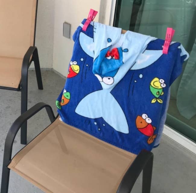 Reviewer's towel attached to a chair with two pink clips