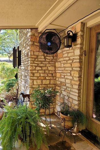 the outdoor fan mounted in a corner on a patio