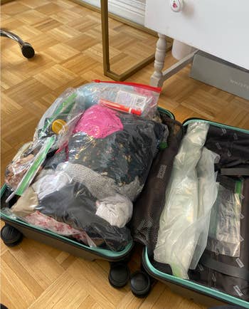 The clothes packed neatly in compression bags to fit in the suitcase