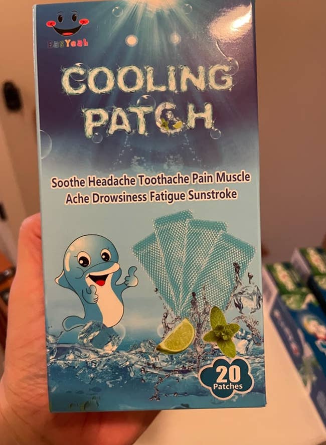 Reviewer holding up box of patches