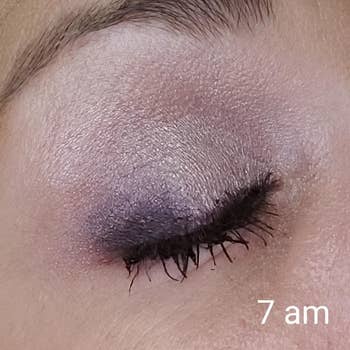 a reviewer's closed eye with eyeshadow on labeled