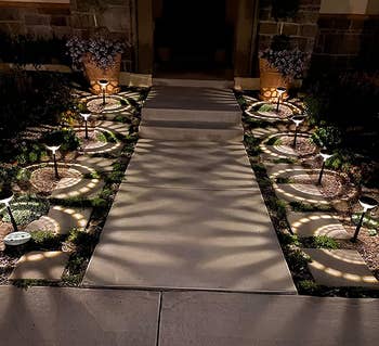 a reviewer photo of the lights lining a walkway casting white light
