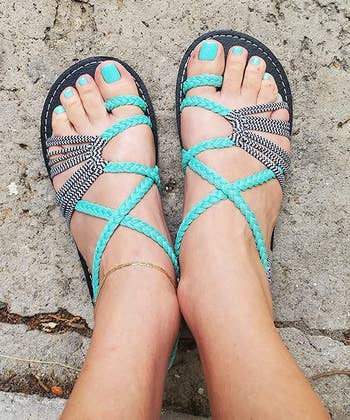another reviewer wearing the teal sandals
