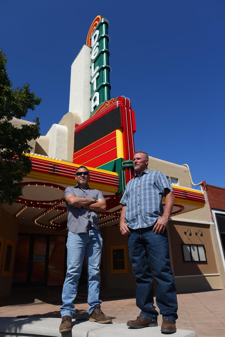 Delta Theater owners Sean McCauley, left, and Ron Harrison, right, stand outside the two screen theater they are renovating on Wednesday, May 8, 2024, in Brentwood, Calif.