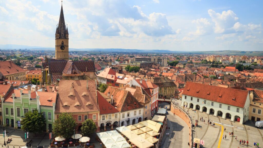 <p>Sibiu, a charming city in Transylvania, Romania, is known for its well-preserved medieval architecture, colorful houses, and lively squares. Explore the Brukenthal National Museum, climb the Council Tower for panoramic views, and sample traditional Romanian dishes like sarmale (stuffed cabbage leaves).</p><p>Sibiu offers excellent <a href="https://www.tripadvisor.com/ShowUserReviews-g295393-d7718144-r627461190-Vila_Sibiu-Sibiu_Sibiu_County_Central_Romania_Transylvania.html">value for money</a>, with affordable accommodations, cheap eats, and free attractions like the Great Square and the Liar’s Bridge. Take a day trip to the nearby Astra Museum of Traditional Folk Civilization, an open-air museum showcasing Romanian rural life.</p>