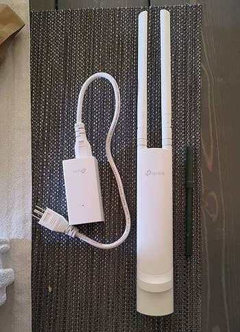 a reviewer photo of the wi-fi extender