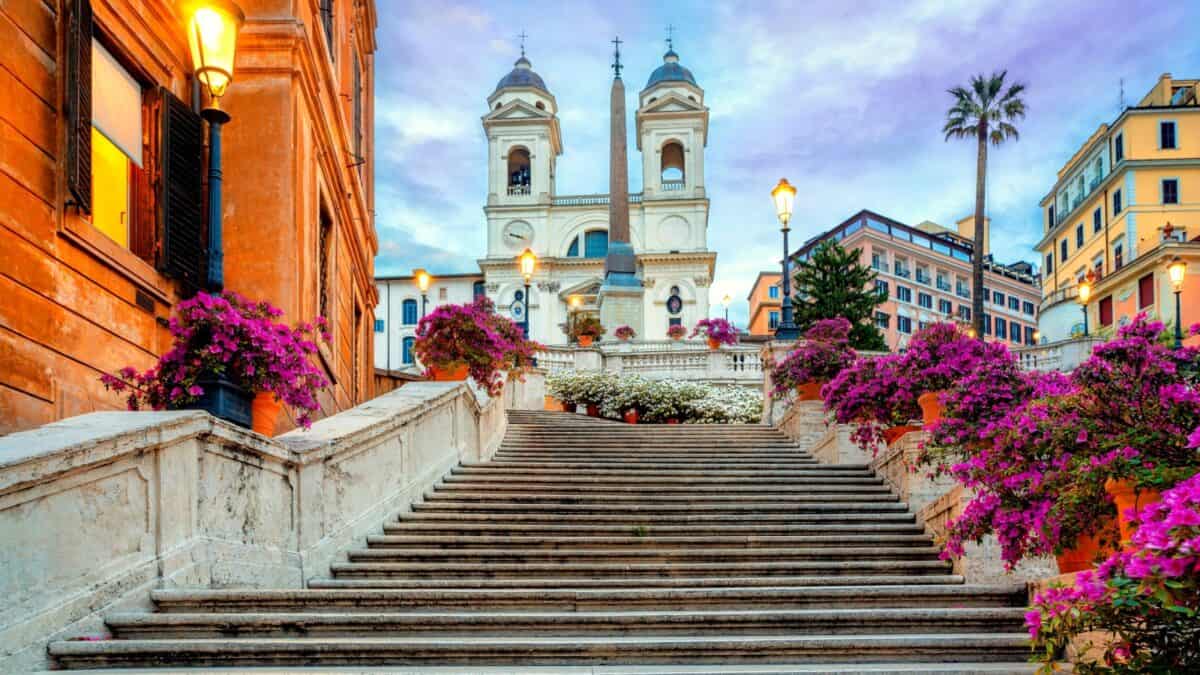 <p>The Spanish Steps, a monumental staircase of 135 steps, connect the Piazza di Spagna with the Trinità dei Monti church in Rome. This iconic landmark is a place of historical significance and a lively gathering spot for locals and tourists. </p><p>The surrounding area is filled with charming cafes and high-end shops, making it a perfect place to soak in the ambiance of Rome. The views from the top of the steps, especially at sunset, are truly captivating.</p>