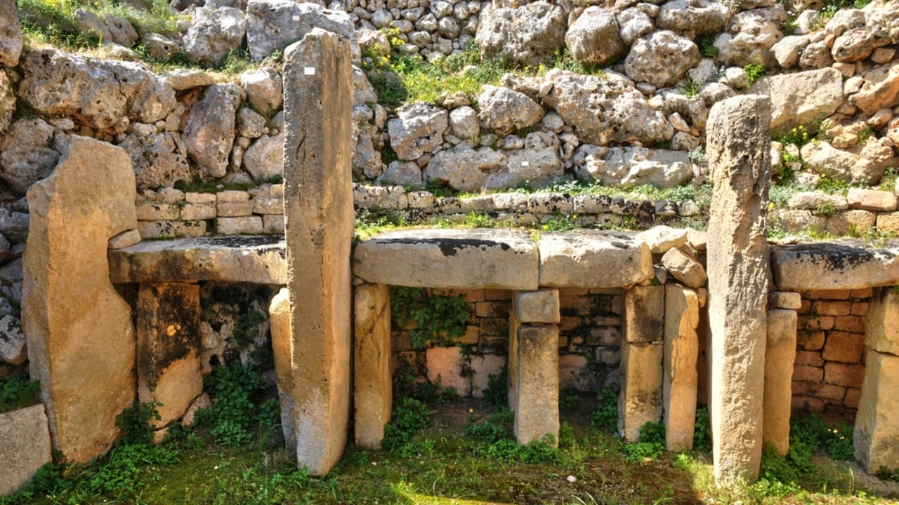 <p><strong>Age</strong>: Approximately 5,500-6,100 years old (3600-2500 BC)<br><strong>Location</strong>: Gozo, Malta </p> <p>On the small Mediterranean island of Gozo, the megalithic temples of Ġgantija have been standing watch over the landscape for more than 5,000 years. These incredible structures, built from massive limestone blocks weighing up to 50 tons, are among the oldest free-standing buildings in the world.</p> <p>The temples of Ġgantija are renowned for their intricate design and precise construction, with some walls featuring delicate spiral carvings and other decorative elements. </p>
