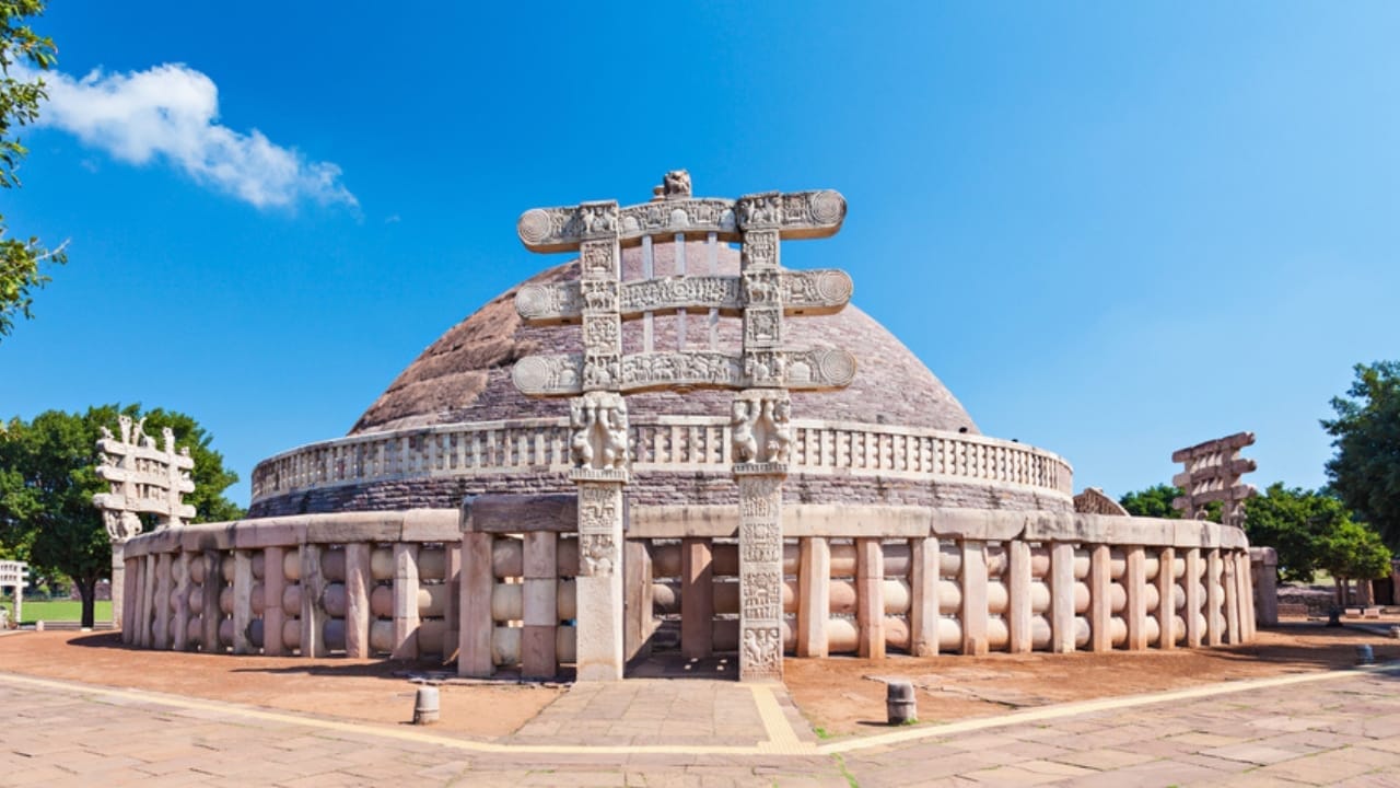 <p><strong>Age</strong>: Approximately 2,200-2,300 years old (3rd century BC)<br> <strong>Location</strong>: Madhya Pradesh, India</p> <p>Perched atop a hill in central India, the Sanchi Stupa is one of the oldest and most important Buddhist monuments in the world. Originally commissioned by the Emperor Ashoka in the 3rd century BC, the stupa was expanded and adorned with intricate carvings and gateways over the centuries that followed.</p> <p>The Sanchi Stupa is notable for its stunning architectural design, which features a large hemispherical dome surrounded by a stone railing and four ornate gateways. The gateways are adorned with intricate carvings depicting scenes from the life of the Buddha and the jataka tales</p>