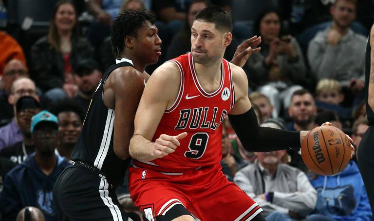 Feb 8, 2024; Memphis, Tennessee, USA; Chicago Bulls center Nikola Vucevic (9) dribbles as Memphis Grizzlies forward GG Jackson (45) defends during the first half at FedExForum. Mandatory Credit: Petre Thomas-USA TODAY Sports
