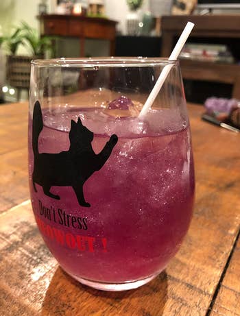 Pink glitter in a wine glass with a drink