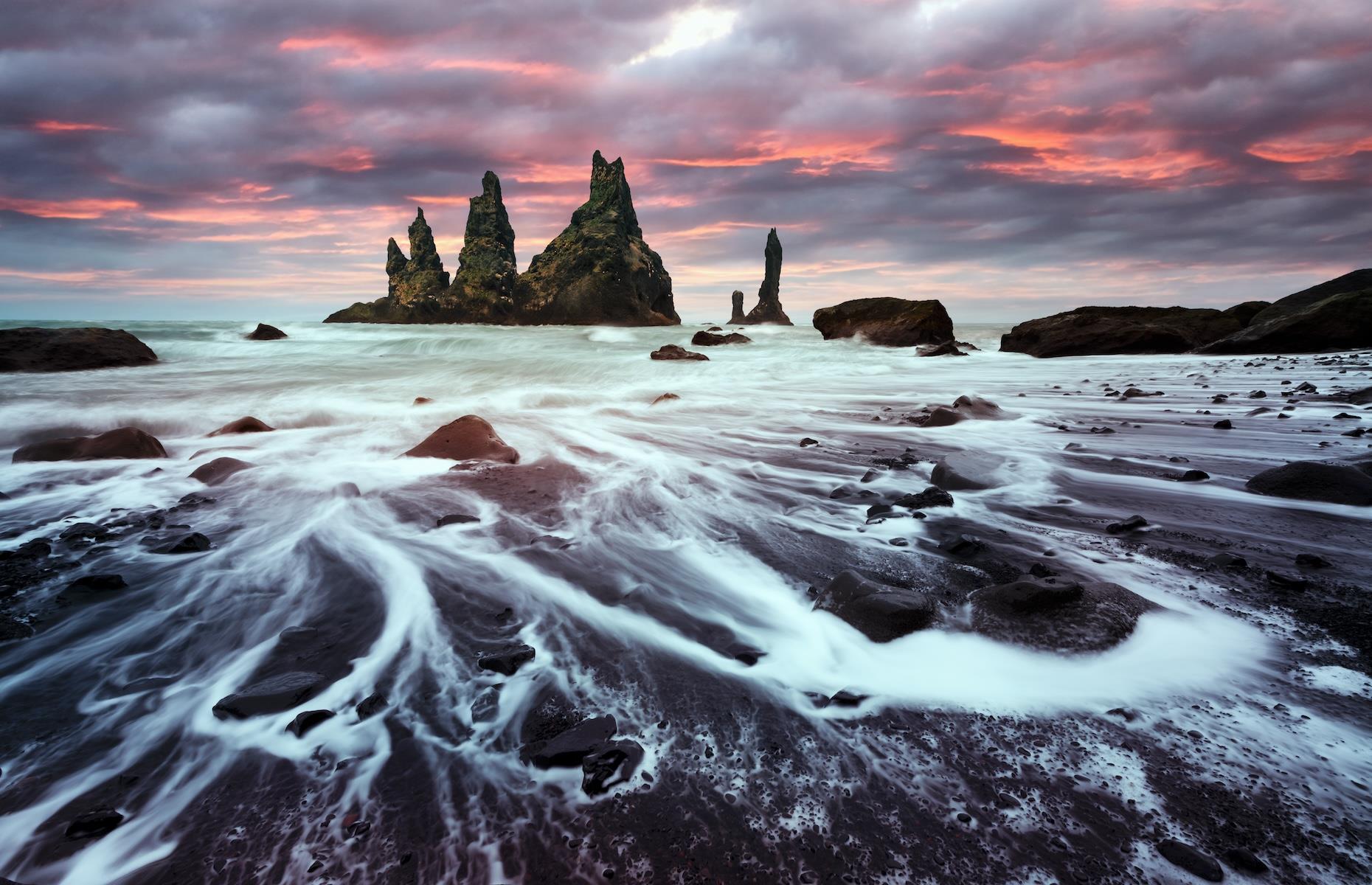 <p>Another otherworldly landscape in northern Europe, Iceland’s famous black beach, Reynisfjara, lures visitors with its bleak and bewitching beauty. As well as its raven-black sand, there are perfectly hexagonal basalt columns, smooth pebbles and jagged wave-pounded sea stacks at this beauty spot on the country’s unprotected south coast, where the North Atlantic crashes in. People come to revel in the moodiness of the seascape as well as to spot the seabirds including puffins, fulmars and guillemots that nest on the unsupervised beach's sea stacks and cliffs.</p>