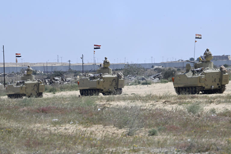 Stock photo of Egyptian army armored vehicles are positioned along the Rafah border with the Gaza Strip on March 23. There was a "shooting incident" at the Egyptian border with Gaza.