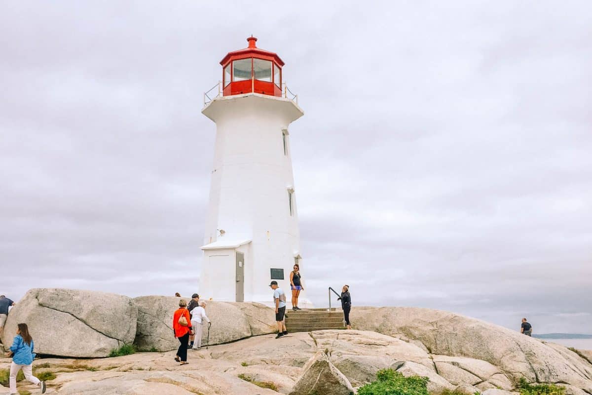 <p>If you haven’t heard of Peggy’s Cove, you have probably seen a picture like this.</p><p>Peggy’s Cove is one of the most picturesque fishing villages on the eastern shore of <a href="https://travelswiththecrew.com/the-cat-ferry-from-maine-to-nova-scotia-review/">Nova Scotia</a>. Tourists flock to the most photographed lighthouse in Canada, built on a large granite rock.</p><p>My kids loved to climb over all of the rocks and find creative ways to scurry down crevices. They would have stayed for hours if we had time.</p><p>The entire town is picturesque and sleepy. Fishing has been the main economy of Peggy’s Cove for centuries, but tourism is fast overtaking it. So hurry and visit this quaint little town while people are still fishing. You will be completely charmed.</p>