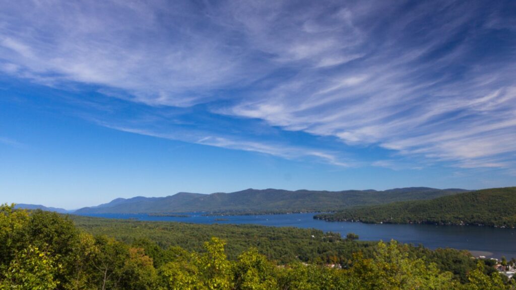 <p>Nestled in the Adirondack Mountains, Lake George is a popular destination for boating, fishing, and water sports. The lake is surrounded by <a href="https://www.visitlakegeorge.com/things-to-do/?adara_campaignid=10326463831&adarapixelid=167626&gad_source=1&gclid=CjwKCAjwx-CyBhAqEiwAeOcTdWRzvup9SfXxb15RmIkLyFI6TKokdKryqmBdUu_dBc33eKFmlk3AWRoCJswQAvD_BwE">scenic mountains</a>, forests, and charming villages, offering endless opportunities for outdoor exploration and relaxation.</p><p>Explore the historic Fort William Henry, a restored 18th-century stronghold that offers a glimpse into the region’s colonial past. Take a boat tour of the lake, or hike to the top of Prospect Mountain for panoramic views. Lake George also boasts a lively downtown with shops, restaurants, and entertainment options.</p>