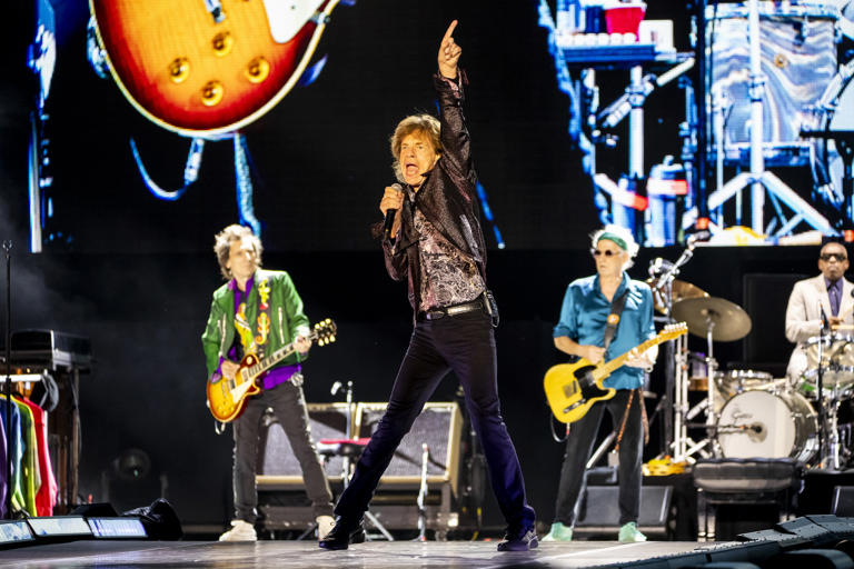 The Rolling Stones, including frontman Mick Jagger, center, and guitarists Ronnie Wood, left, and Keith Richards perform at Camping World Stadium on their Hackney Diamonds tour in Orlando on June 3, 2024.