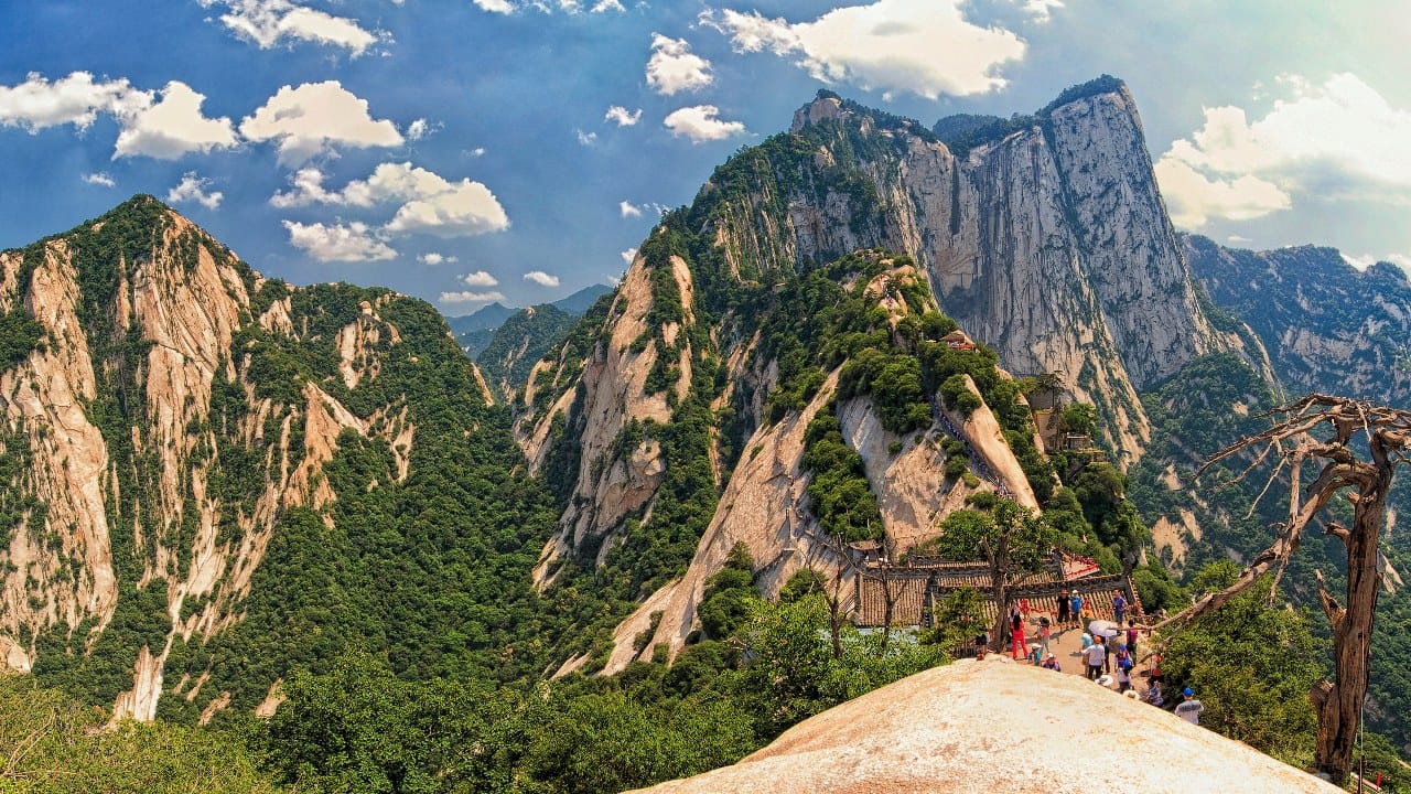 <p>When I first saw pictures of what participants have to walk and climb at Mount Hua, the words that came out of my mouth weren’t pleasant. This tourist attraction is famous for its treacherous trails, including the notorious “Plank Walk in the Sky.” Here, hikers navigate narrow wooden planks bolted to the cliffside.</p><p>The paths are extremely narrow, with steep drops and minimal safety measures. While exact death tolls are hard to confirm, it’s <a href="https://www.yahoo.com/lifestyle/everything-know-hiking-mount-huashan-145700467.html#:~:text=While%20it's%20not%20officially%20known,leads%20to%20the%20Huashan%20teahouse.">said that around 100</a> fatalities occur each year. In 2019, a tourist taking selfies fell backward over a two-foot-high guardrail fence. </p>