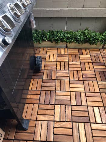 the teak tiles underneath a grill