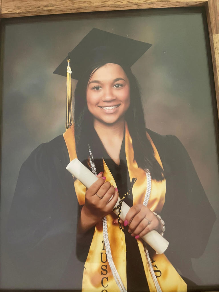 Karaline "Kara" Bryson photographed in her Tuscola High cap and gown. The high school honored Bryson's life and sudden loss by laying a gown on a vacant chair and holding a moment of silence during the school's graduation ceremony.