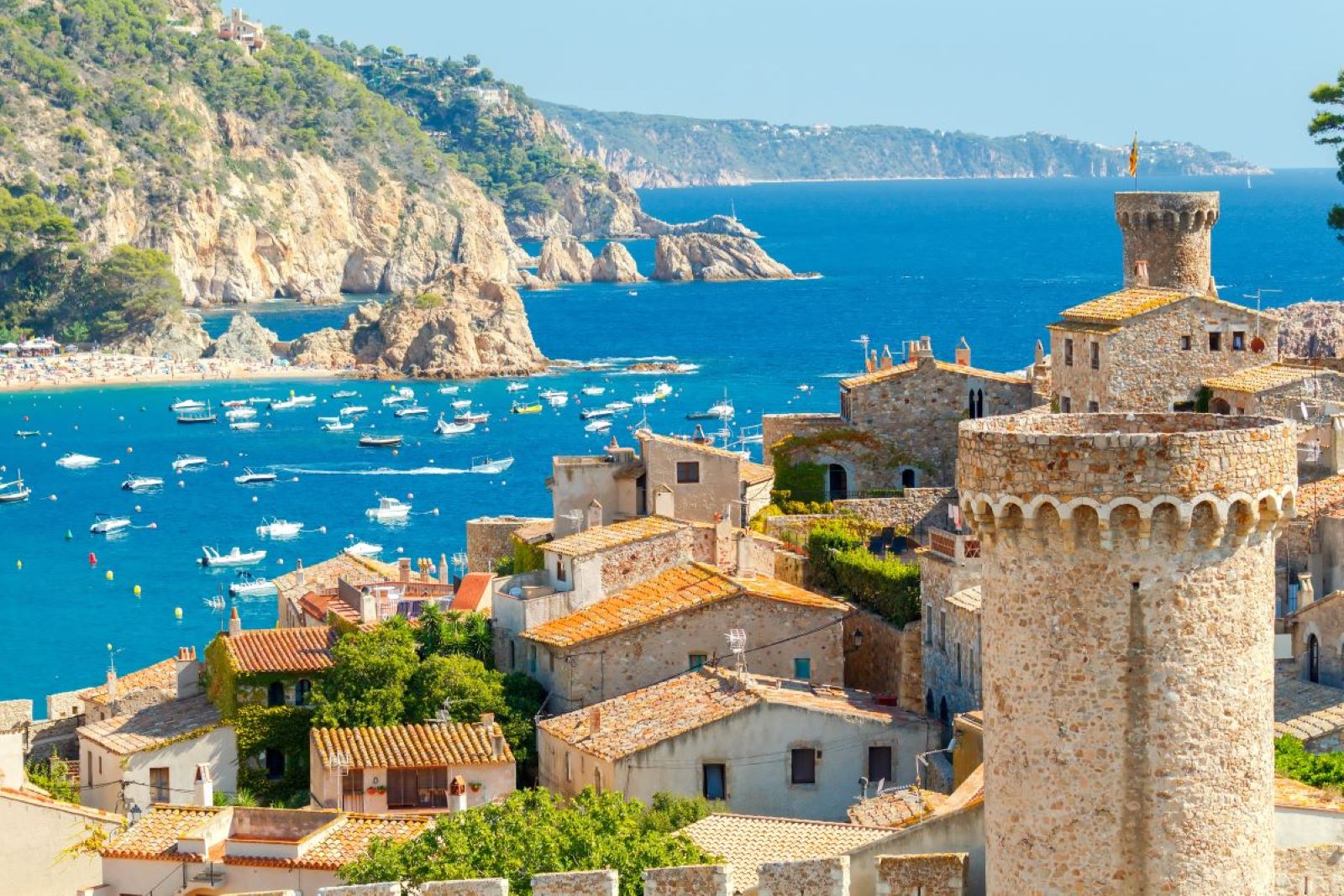 <p class="wp-caption-text">Image Credit: Shutterstock / kavalenkau</p>  <p><span>The Costa Brava, located in the northeastern corner of Spain, is a stunning stretch of coastline known for its rugged beauty, crystal-clear waters, and sandy coves between cliffs. The region extends from the town of Blanes to the French border, offering a diverse landscape that includes the serene beaches of Calella de Palafrugell and the wild, untouched beauty of Cap de Creus Natural Park. The Costa Brava is not just about its beaches; it’s also rich in cultural heritage, with medieval towns like Girona and Pals and the surreal architecture of Salvador Dalí in Figueres and Cadaqués. The area is renowned for its culinary excellence, with several Michelin-starred restaurants and local dishes that highlight Catalonia’s rich gastronomic tradition.</span></p> <p><b>Insider’s Tip: </b><span>Visit the medieval village of Peratallada, a lesser-known gem with beautifully preserved stone architecture, artisan shops, and quaint restaurants offering traditional Catalan cuisine.</span></p> <p><b>When to Travel: </b><span>The best time to visit the Costa Brava is from May to June and September to October, when the weather is pleasant, and the summer crowds have dissipated.</span></p> <p><b>How to Get There: </b><span>The nearest major airport is in Barcelona, from which the Costa Brava is easily accessible by car, bus, or train. Renting a car is recommended for exploring the region’s more secluded beaches and historic towns.</span></p>