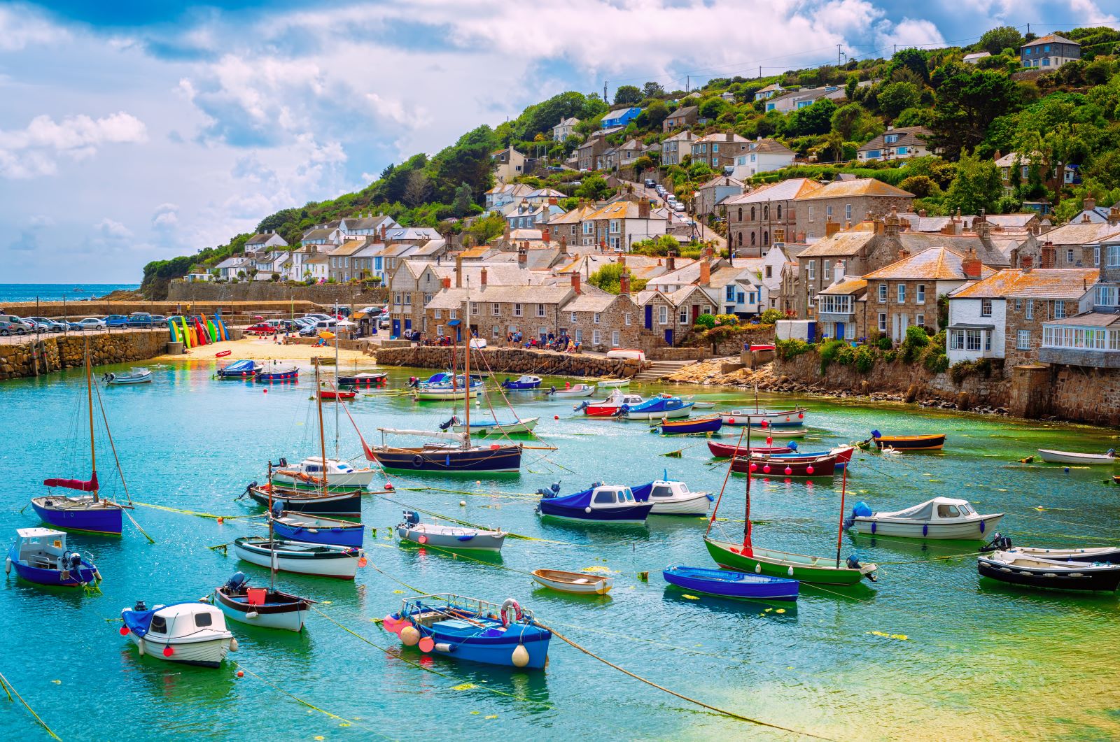 <p class="wp-caption-text">Image Credit: Shutterstock / Boris Stroujko</p>  <p><span>Cornwall, at the southwestern tip of England, is a picturesque county known for its rugged coastline, quaint fishing villages, and beautiful sandy beaches. Dramatic cliffs, hidden coves, and the expansive moors inland mark the region’s landscape. Cornwall’s maritime heritage is alive in its ports and harbors, where traditional fishing boats are still a common sight. The South West Coast Path offers miles of scenic walks along the coastline, providing access to some of the area’s most stunning views and secluded beaches. Cornwall is also rich in folklore and history, adding ancient stone circles and tales of smugglers and pirates to its mystique. The county’s culinary scene thrives, emphasizing local seafood, traditional Cornish pasties, and artisanal products.</span></p> <p><b>Insider’s Tip: </b><span>For a unique experience, visit the Minack Theatre, an open-air theater carved into the granite cliff overlooking the Atlantic Ocean. Check the schedule for performances or visit during the day to enjoy the spectacular setting.</span></p> <p><b>When to Travel: </b><span>The best time to visit Cornwall is from May to September when the weather is warmer and drier, making it ideal for exploring the outdoors and enjoying the beaches.</span></p> <p><b>How to Get There: </b><span>The nearest major airports are Exeter and Newquay, and train services from London and other major cities are also available. Renting a car is recommended for exploring Cornwall’s more remote areas and coastal villages.</span></p>