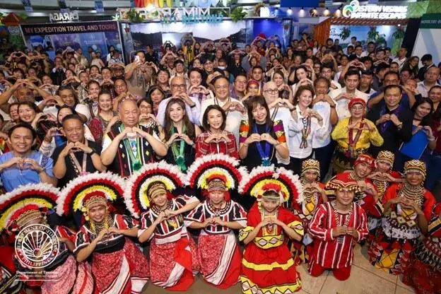 DOT Secretary Christina Frasco with Mindanao local and cultural performers, participated in the Mindanao Tourism Expo (MTEx) held at the Limketkai Center in Cagayan de Oro City. Photo from the Department of Tourism Facebook page.