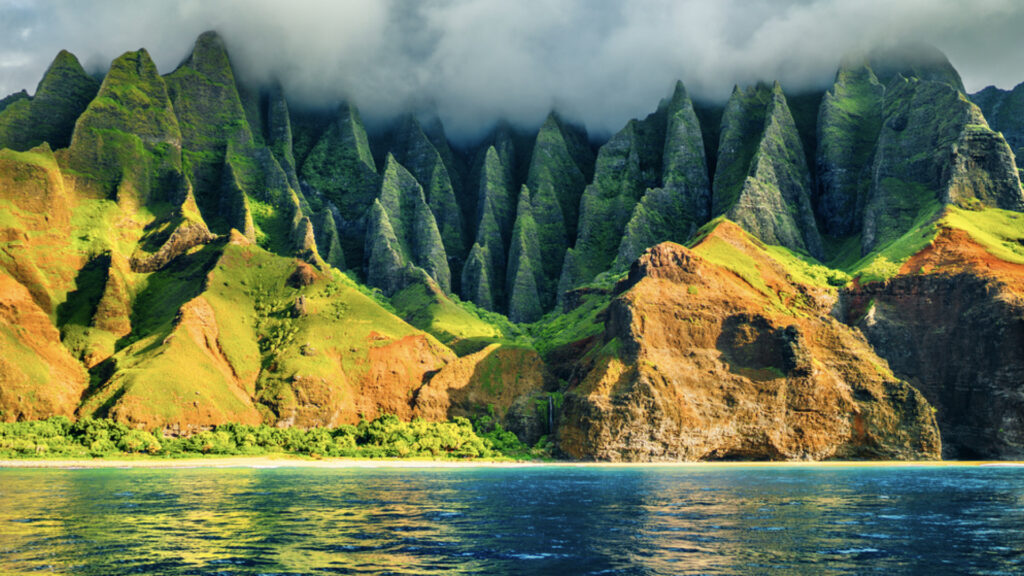 <p>The Hawaiian Archipelago is famous for its breathtaking landscapes and pristine stretches of sand. However, it isn’t all sunshine and rainbows there. Tucked away on Kauai’s Na Pali Coast is one of the world’s most dangerous beaches.</p><p>Accessible exclusively via the Kalalau Trail, Hanakapiai Beach is a ribbon of sand backed by rugged cliffs and dense forest. It’s a beautiful spot – but looks can be deceiving. This place is renowned for intense rip currents and waves that regularly pull people out to sea.</p>