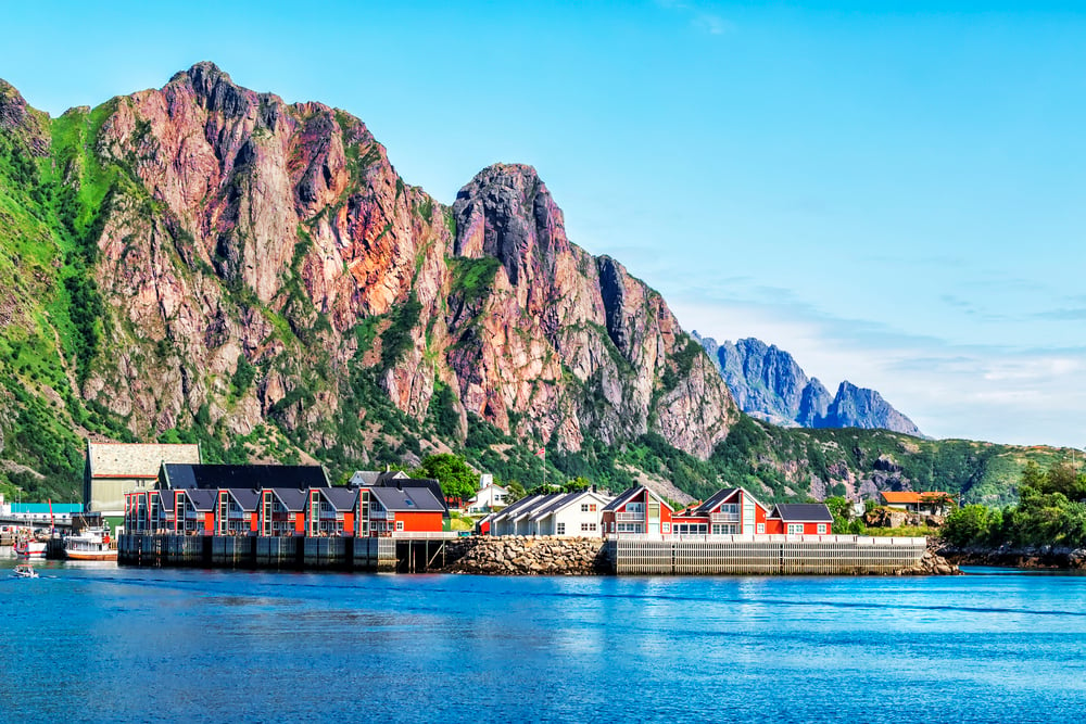 <p>Svolvaer is the largest town in the Lofoten Islands and a hub for tourism and fishing. Despite its size, it maintains a charming small-town feel.</p><p>The town is surrounded by towering mountains and fjords, making it a popular outdoor spot for hiking and kayaking. Plus its not as crowded as some of the other towns in the area!</p><p>Visit the Svolvaergeita, a famous pair of peaks that resemble a goat, for a challenging but rewarding hike. Don’t forget to stop by the Svolvaer Fish Market to sample some of the freshest seafood you’ll ever taste.</p>