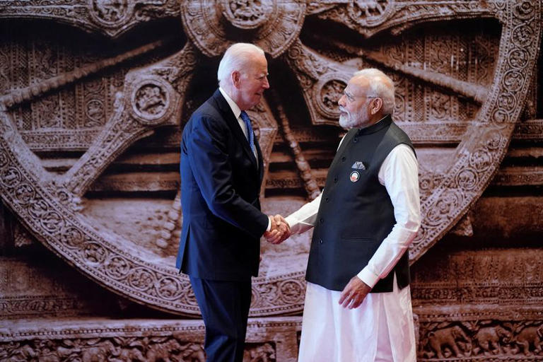 FILE PHOTO: Indian Prime Minister Narendra Modi welcomes U.S. President Joe Biden upon his arrival at Bharat Mandapam convention center for the G20 Summit, in New Delhi, India, Saturday, Sept. 9, 2023.  Evan Vucci/Pool via REUTERS/File Photo