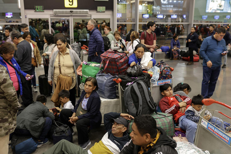 Travelers remain stranded at Peru’s main Jorge Chavez International Airport in Callao, Lima, on June 3.