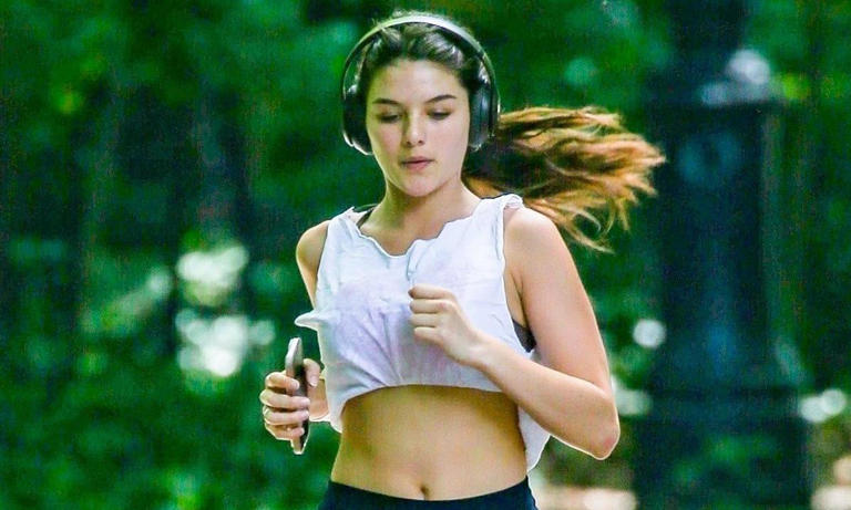 Suri Cruise wears white crop top and black shorts while working out in New York City