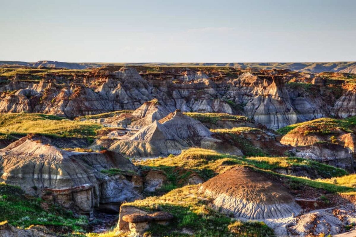<p><span>At first glance, Dinosaur Provincial Park's otherworldly landscapes resemble those in America's </span><a href="https://www.mileswithmcconkey.com/badlands-national-park-in-south-dakota-what-you-should-know/"><span>Badlands National Park</span></a><span>. The family-friendly park features some of the world's most extensive fossil fields, classic badlands landscapes, and a cottonwood river habitat. Its fossil fields have yielded discoveries of over 40 dinosaur species from the "Age of Reptiles," 75 million years ago.</span></p><p><span>Visitors can participate in guided hikes and tours, take a self-guided hike, search for fossils, and explore the odd rock formations in the scramble zone. The park has two outdoor fossil displays along its public scenic loop road. One is a nearly complete skeleton of a duck-billed dinosaur, and the other is a re-creation of a dig site.</span></p>