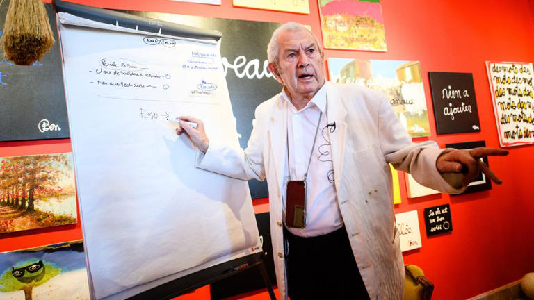 Ben writes on a white board during the press preview of his exhibition "We are all crazy" at the Museum of Naive Arts Anatole Jakovsky in Nice on May 12, 2023. - Clement Mahoudeau/AFP/Getty Images