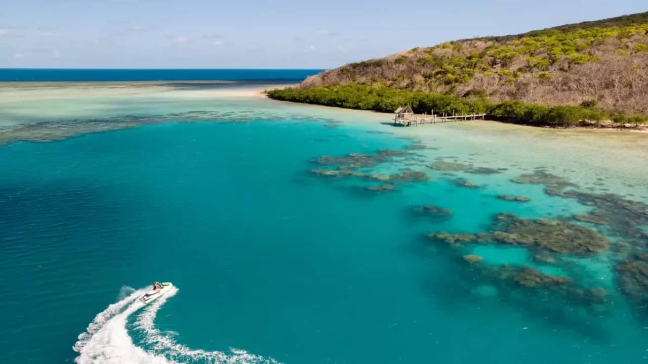 <p>Located in the northern part of the Great Barrier Reef, Haggerstone Island is a private oasis. It houses a self-sufficient luxury eco-resort and offers numerous island trails for exploration. The surrounding waters are home to shipwrecks, World War II artifacts, and the remarkable marine life that the reef is known for.</p><p>Haggerstone Island Resort maintains low guest numbers, often with less than ten people visiting at a time.</p><p>Visitors are accommodated in a set of upscale huts arranged around the main house, a communal building constructed from driftwood, timber, and grass roofing from Bali. Guests can reach the island by a private charter flight from Cairns or Weipa in Queensland, Australia.</p>