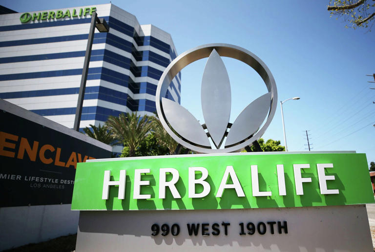 FILE: A sign for Herbalife is displayed outside one of the company's offices on Aug. 28, 2020, in Torrance, Calif. 
