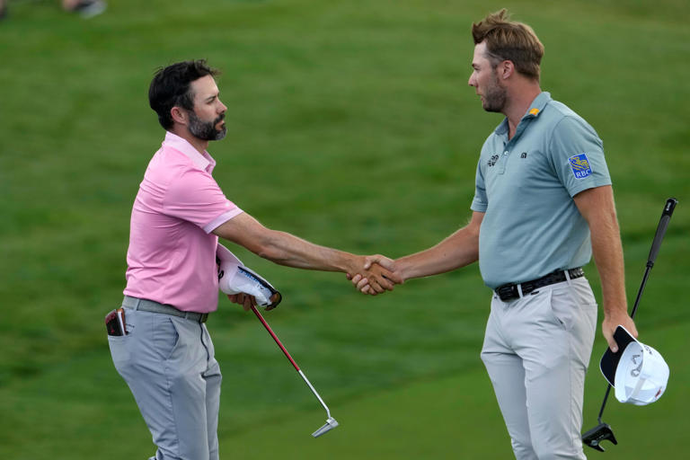 Jun 6, 2024; Dublin, Ohio, USA; Adam Hadwin (left) and Sam Burns shake hands on the 18th green during the first round of the Memorial Tournament at Muirfield Village Golf Club. Mandatory Credit: Barbara J. Perenic-USA TODAY Sports