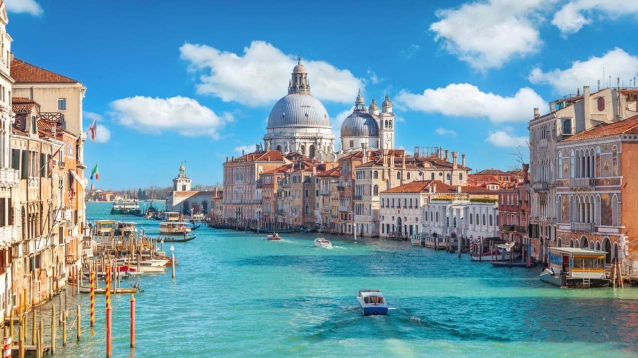 <p>Venice, with its winding canals and historic charm, offers a unique blend of history and romance. The city is renowned for its artistic heritage, stunning architecture, and cultural festivals. Venice’s timeless beauty and enchanting atmosphere make it a top destination for couples.</p> <ul> <li><strong>Grand Canal:</strong> Experience Venice by gondola.</li> <li><strong>Rialto Bridge:</strong> Iconic and historic.</li> <li><strong>Campo Santa Margherita:</strong> Quaint and romantic streets.</li> <li><strong>St. Mark’s Basilica:</strong> Stunning views from the Campanile.</li> </ul>