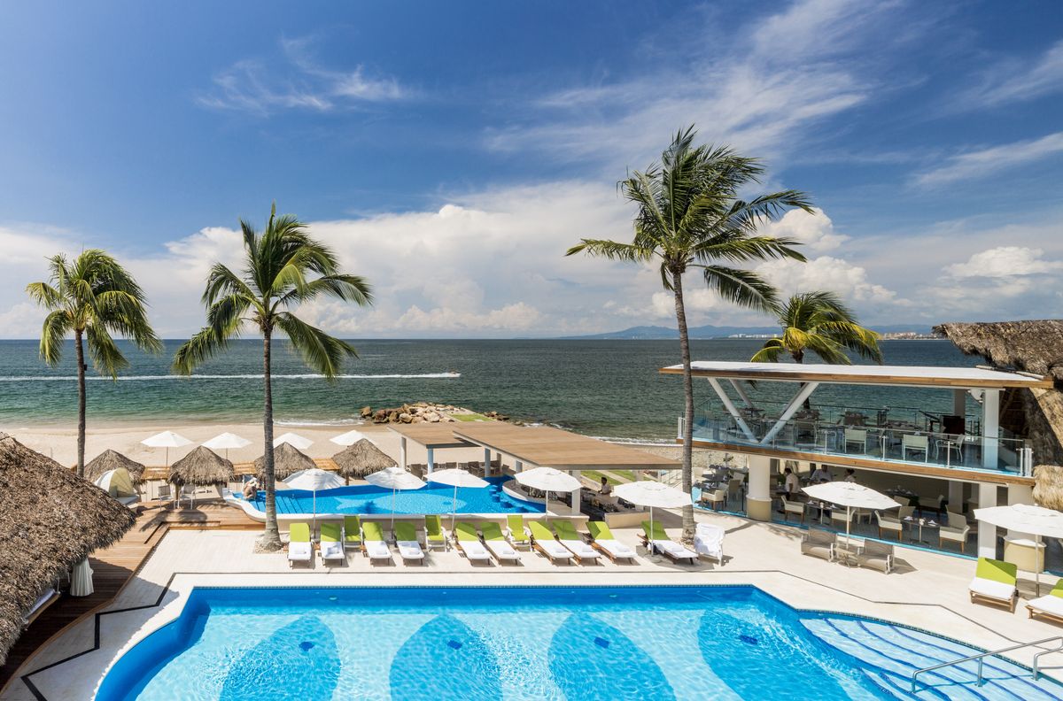 <p>Situated directly on the beachfront of Banderas Bay, <a href="https://go.redirectingat.com?id=74968X1553576&url=https%3A%2F%2Fwww.tripadvisor.com%2FHotel_Review-g150793-d254471-Reviews-Villa_Premiere_Boutique_Hotel_Romantic_Getaway-Puerto_Vallarta.html&sref=https%3A%2F%2Fwww.veranda.com%2Ftravel%2Fg60931138%2Fbest-all-inclusive-resorts-puerto-vallarta%2F">Villa Premiere</a> presents the charm of a boutique hotel just minutes from downtown Puerto Vallarta. Upon arrival, guests receive a five-minute anti-stress massage and a welcome glass of Champagne before being escorted to their luxe suites. While the resort features three unique restaurants, the unmissable culinary highlight is the Chef's Table—a five-course pairing menu enjoyed on Murales Terrace with its stunning ocean backdrop. </p><p><a class="body-btn-link" href="https://go.redirectingat.com?id=74968X1553576&url=https%3A%2F%2Fwww.tripadvisor.com%2FHotel_Review-g150793-d254471-Reviews-Villa_Premiere_Boutique_Hotel_Romantic_Getaway-Puerto_Vallarta.html&sref=https%3A%2F%2Fwww.veranda.com%2Ftravel%2Fg60931138%2Fbest-all-inclusive-resorts-puerto-vallarta%2F">Shop Now</a></p>